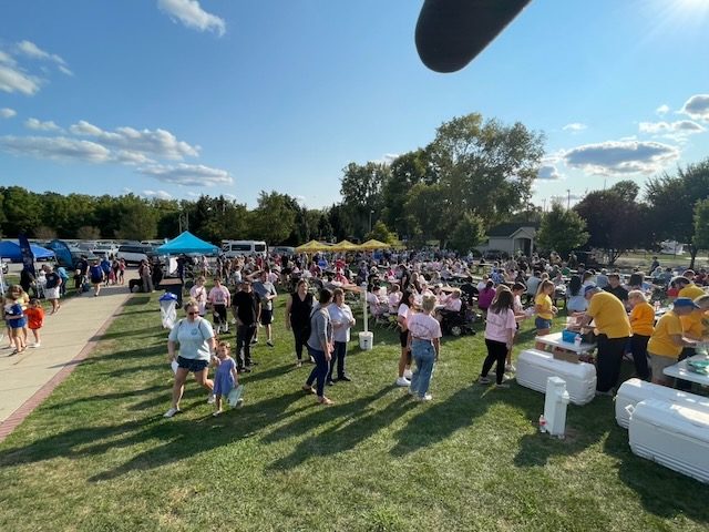 Hundreds of guests filling the field at the VIP Carnival